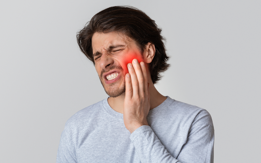 man with mouth pain